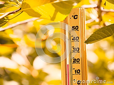 Isolated Thermometer making 20 degrees celsius temperature in Autumn season Stock Photo